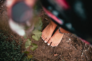 woman barefoot on ground